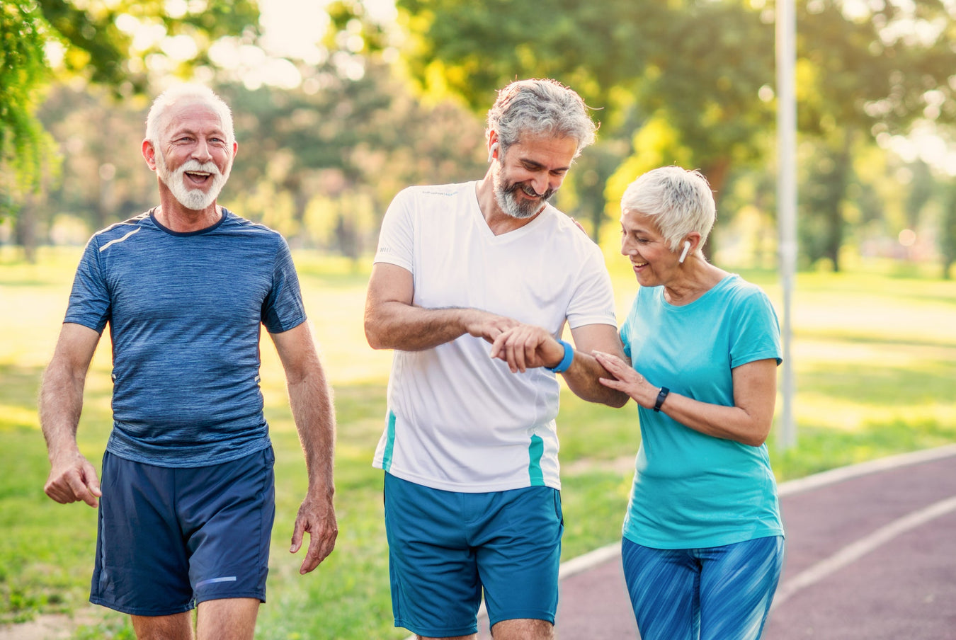 three healthy older people exercising